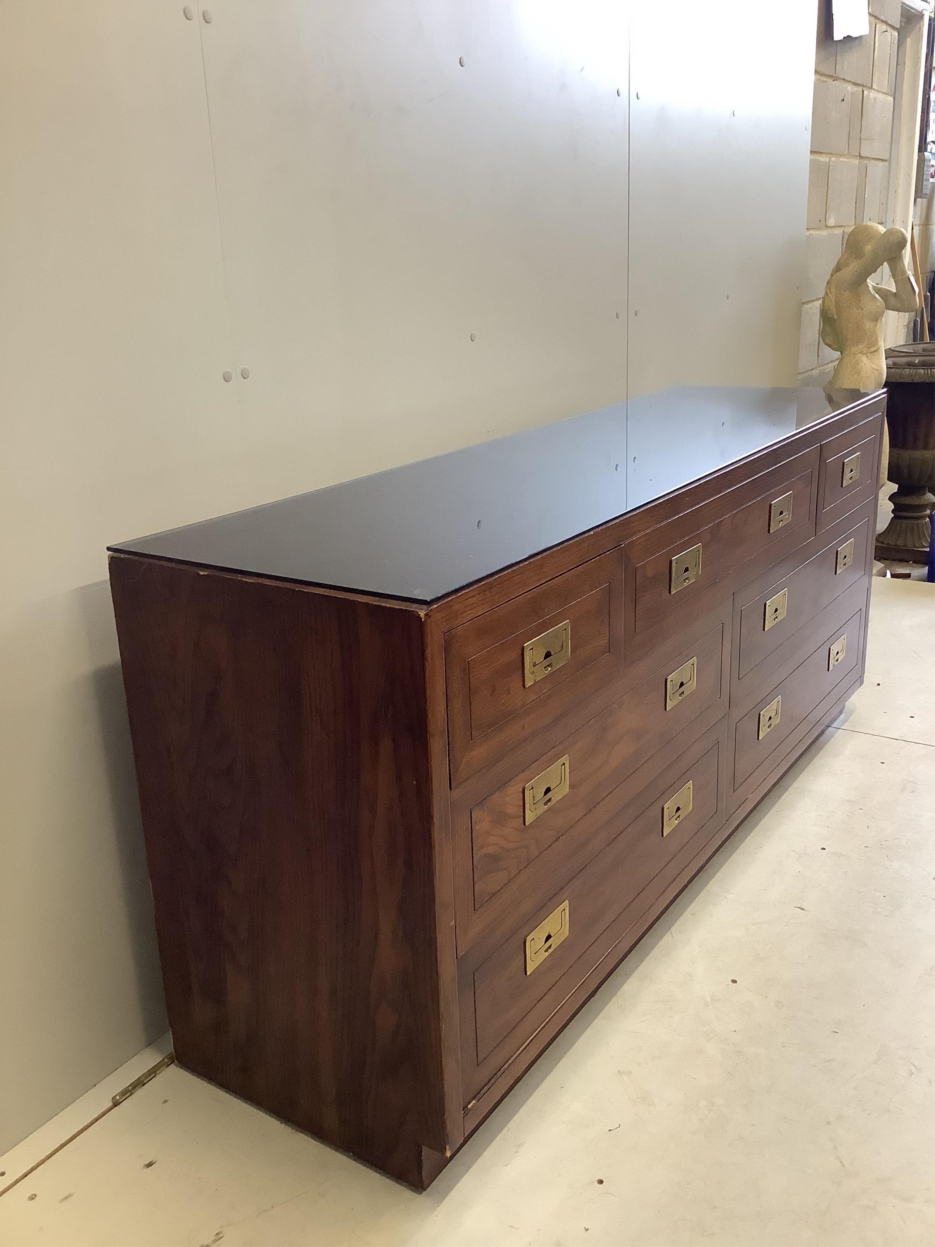 A Chinese style brass mounted elm low sideboard, width 162cm, depth 46cm, height 72cm. Condition - fair to good